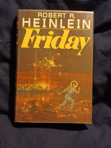 Friday by Robert A Heinlein.  Inscribed by Heinlein