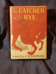 Catcher In The Rye by J.D. Salinger.  FIRST EDITION with dust jacket